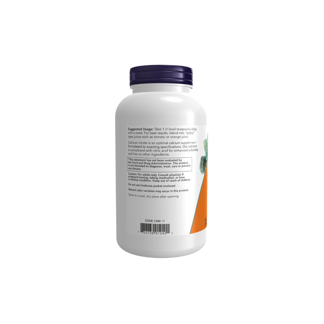 A white Now Foods supplement bottle with a purple cap and label showing nutritional information, an image of carrots, and highlighting bone health.