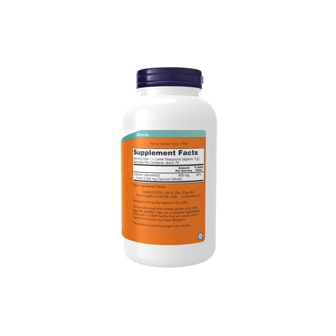 A white supplement bottle with an orange and blue label displaying nutritional information and bone health benefits for Now Foods' Calcium Citrate Pure Powder 227g on a plain background.