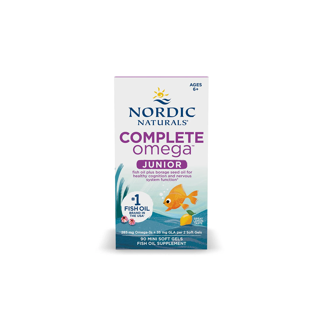 Nordic Naturals' Complete Omega Junior 283 mg, presented in a box containing 90 soft gels, is designed to support children's health and wellbeing with Omega-3 fatty acids. It's ideal for children aged 6 and older, featuring a fish image alongside the branding details.