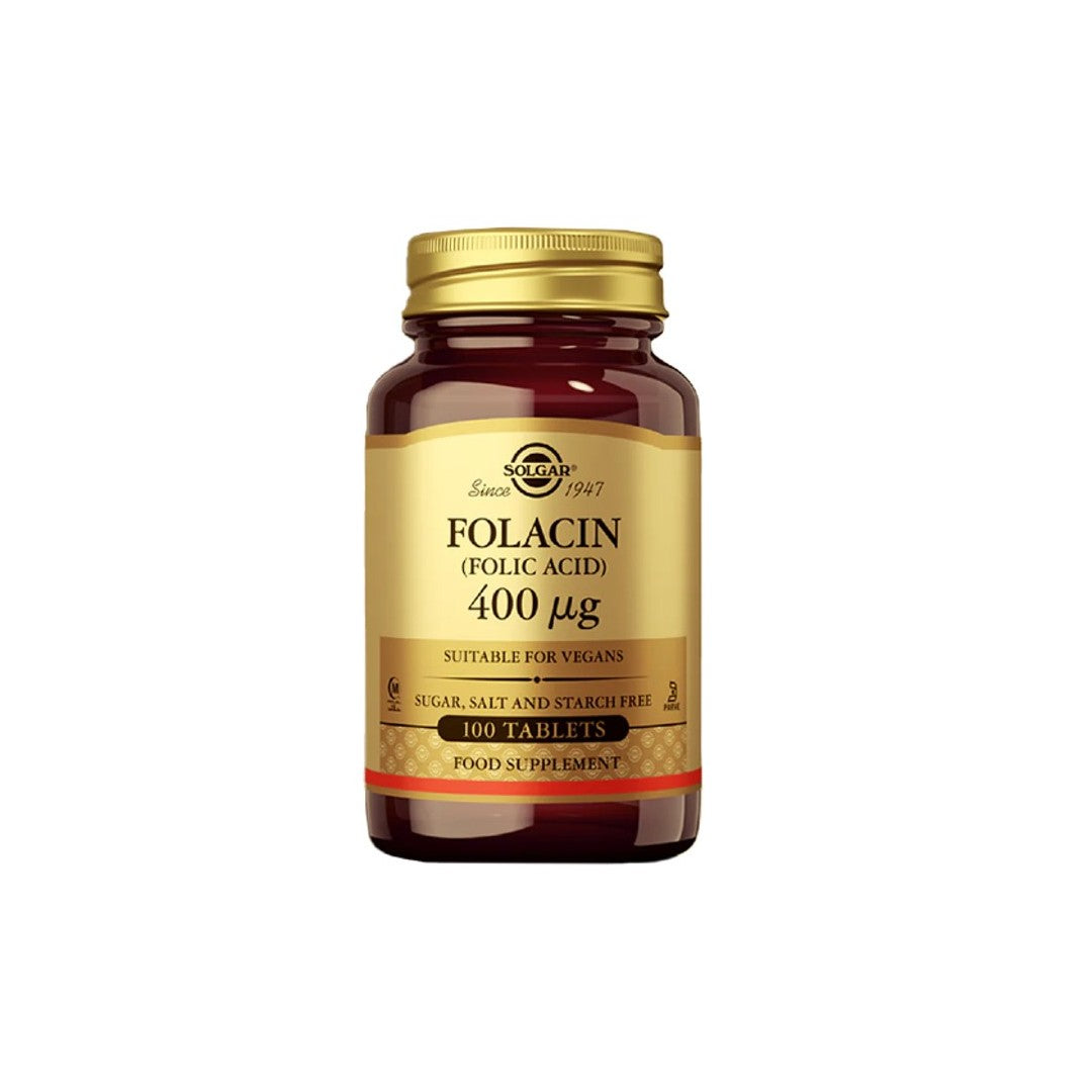 A bottle of Solgar Folacin (Folic Acid) 400 mcg dietary supplement for prenatal health, clearly labeled as sugar, salt, and starch free, containing 100 tablets.
