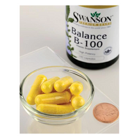 Thumbnail for A glass bowl with yellow capsules sits beside a penny, with a Swanson Balance Vitamin B-100 Complex 100 Capsules bottle in the background, emphasizing its essential B vitamins for metabolic support.