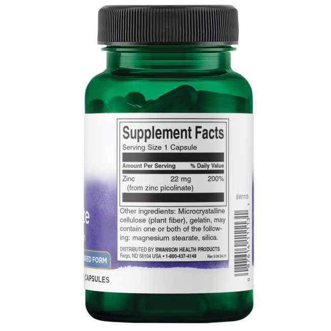 Swanson’s green bottle labeled "Supplement Facts" contains Zinc Picolinate 22 mg capsules, which support the immune system. The side label provides ingredients, dosage, and distributor details.