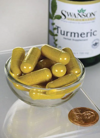 Thumbnail for A small glass bowl filled with Swanson's Turmeric 720 mg capsules, known for curcuminoids that support joints, sits next to a U.S. penny on a clear surface. In the background, a bottle marked 