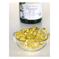 Thumbnail for A small glass bowl filled with yellow Swanson Vitamin D3 5000 IU softgels, vital for bone health and a strong immune system, sits in the foreground, while a blurred bottle of the same stands behind.