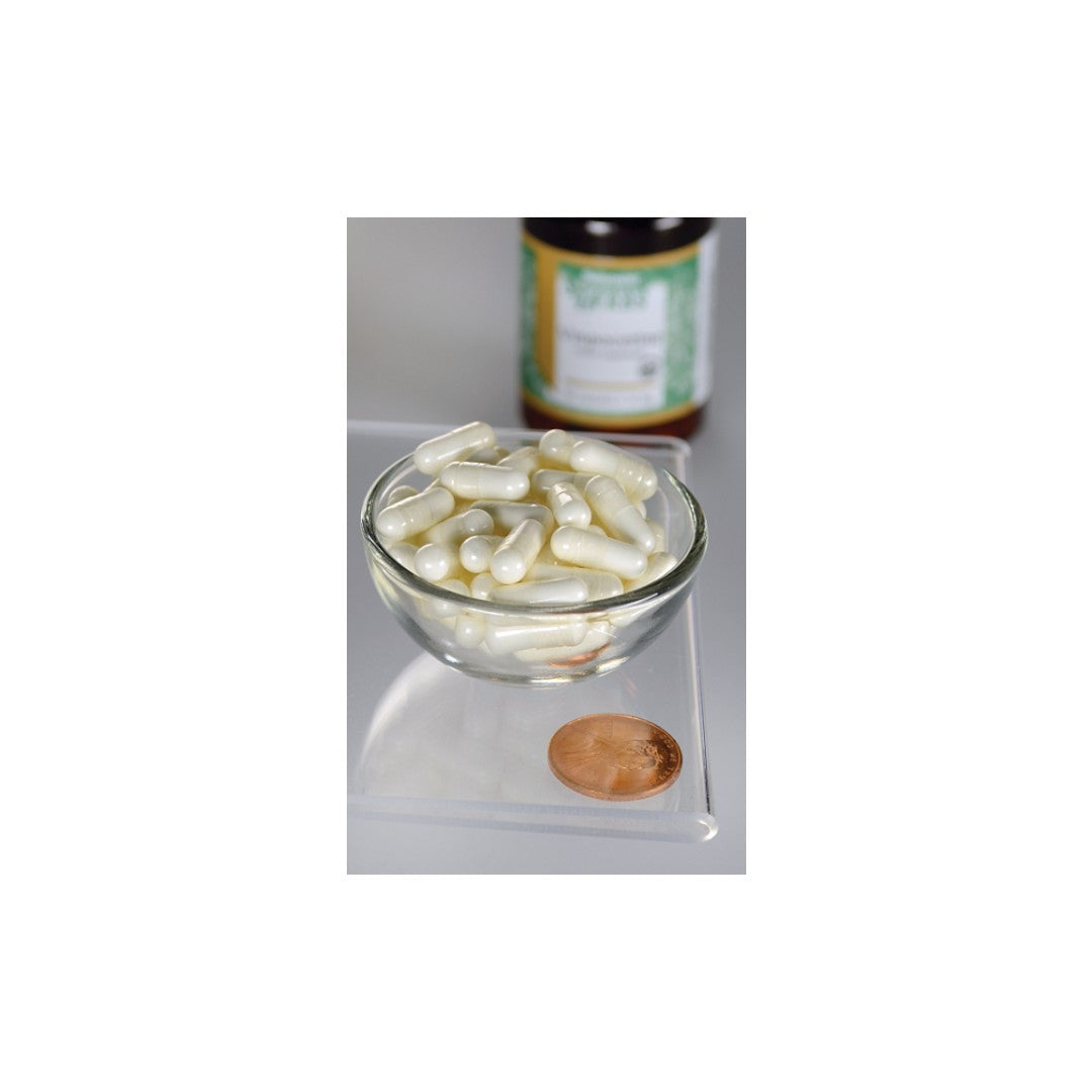 A bowl of white Vinpocetine - 10 mg 90 capsules pills and a bottle of peanut butter, promoting healthy memory and concentration with the Swanson supplement.