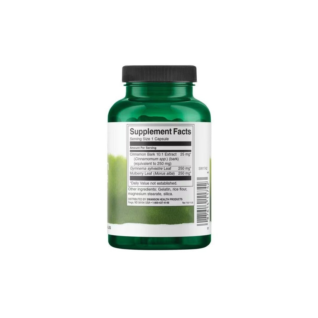 Green supplement bottle with a label showing supplement facts for Swanson Cinnamon, Gymnema & Mulberry Complex capsules designed for blood sugar regulation.