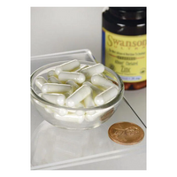 Thumbnail for A small glass bowl with white capsules lies beside a 