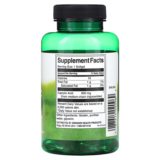 The Swanson Caprylic Acid 600 mg 60 Softgels come in a green bottle with a black cap, featuring the supplement facts. Each serving provides 1g total fat and 600mg MCT-rich caprylic acid, known for its antifungal properties.