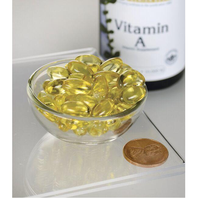 A bowl of Swanson's Vitamin A - 10000 IU 250 softgels sits next to a bottle, promoting immune health and supporting vision.