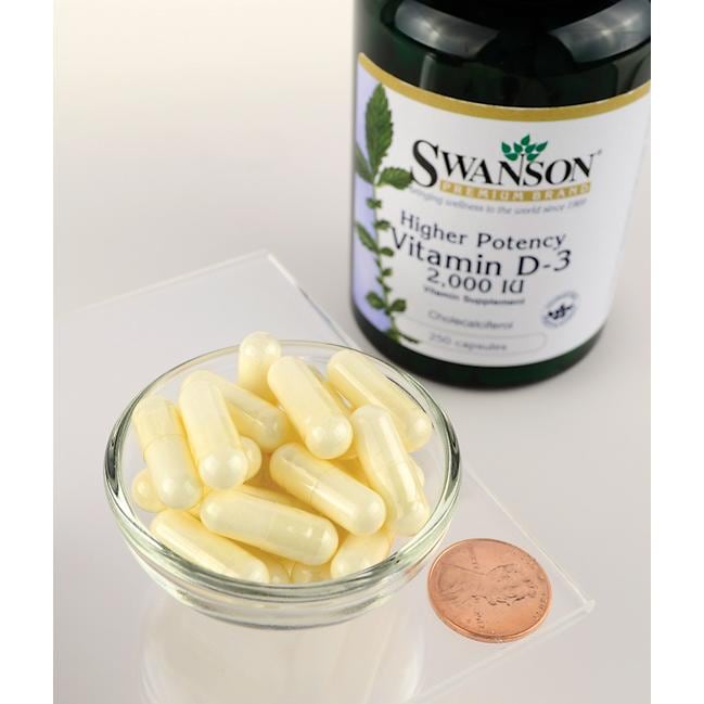 Swanson Vitamin D3 - 2000 IU 250 capsules for bone health, displayed in a bowl next to a penny.