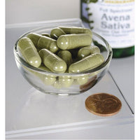 Thumbnail for Eine Schale Swanson Avena Sativa - 400 mg 60 Kapseln neben einer Flasche Olivenöl.