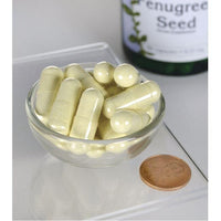 Vorschaubild für Eine Flasche Swanson Bockshornkleesamen - 610 mg 90 Kapseln steht neben einer Schale mit Kapseln.
