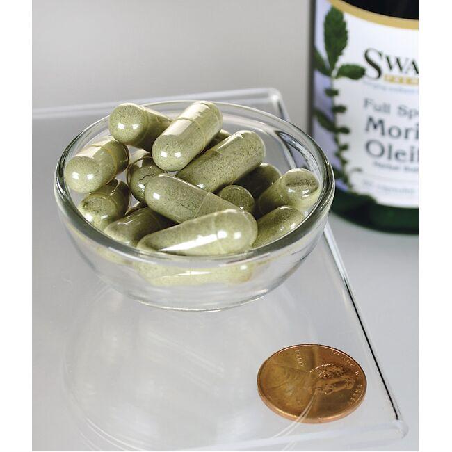 SwansonMoringa Oleifera - 400 mg 60 Kapseln in einer Schale neben einer Flasche Moringa Oleifera von Swanson, um die Vorteile der Reduzierung von oxidativem Stress und Zellschäden hervorzuheben.