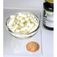 Vorschaubild für Eine Schale Swanson Melatonin 3 mg 60 Kapseln neben einem Pfennig.