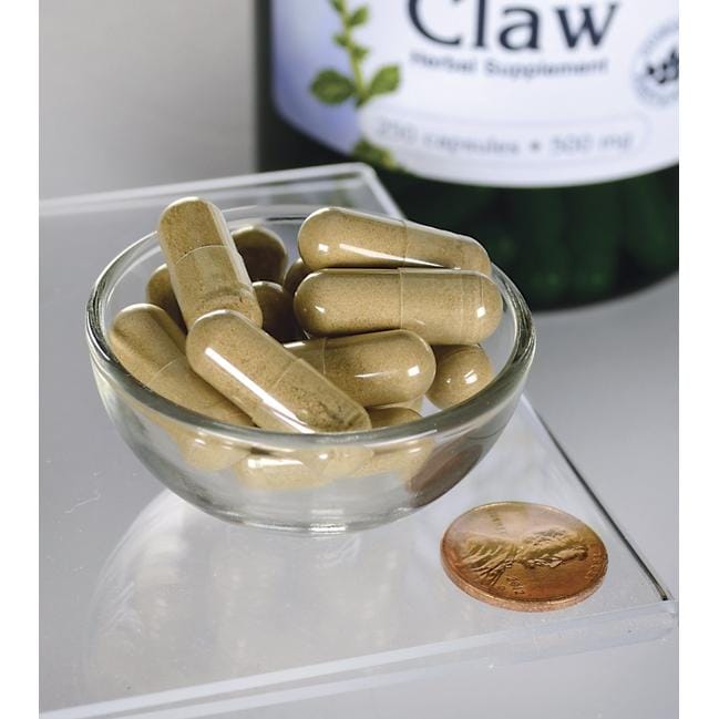 Eine Schale mit Swanson's Cats Claw - 500 mg 250 Kapseln neben einer Flasche.