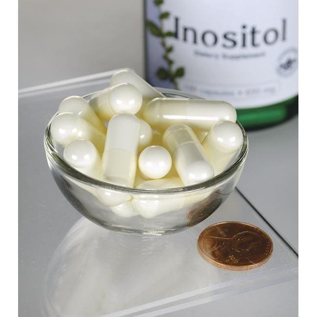 Swanson Inositol - 650 mg 100 Kapseln in einer Schale neben einer Flasche Swanson Inositol.