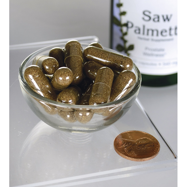 SwansonSaw Palmetto - 540 mg 100 Kapseln, ein beliebtes Nahrungsergänzungsmittel für die Prostata, sind in einer Schale neben einem Penny ausgestellt.