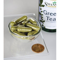 Vorschaubild für Eine Flasche Swanson Grüner Tee - 500 mg 100 Kapseln mit einem Pfennig daneben.