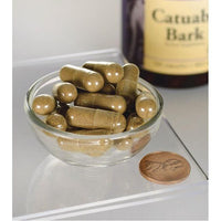 Vorschaubild für Swanson Catuaba Rinde - 465 mg 120 Kapseln in einer Schale neben einer Flasche.
