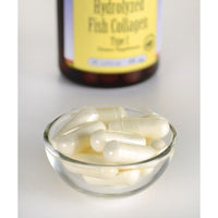 Vorschaubild für Eine Flasche Marine Collagen - 400 mg 60 Kapseln von Swanson neben einer Glasschale.