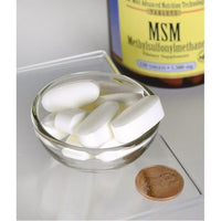 Vorschaubild für Swanson's MSM - 1.500 mg 120 Tabs mit entzündungshemmenden Eigenschaften in einer Schale neben einem Penny.