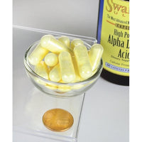 Thumbnail for Eine Flasche Swanson Alpha-Liponsäure - 600 mg 60 Kapseln mit einer Münze daneben.