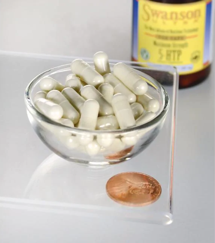 Eine Schale Swanson 5-HTP Maximum Strength 200 mg 60 Capsules neben einem Penny.